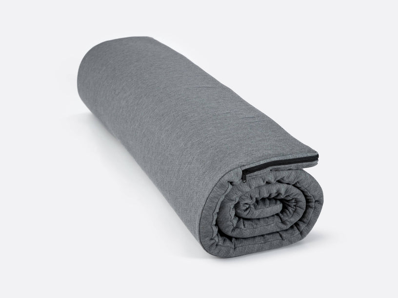 TentBox Cargo Comfort Topper rolled up ready to be stored away