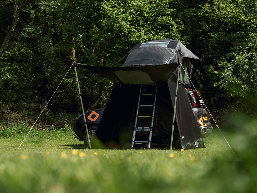 TentBox Lite 2.0 Living Pod with front panel opened, helping protect customer from the rain