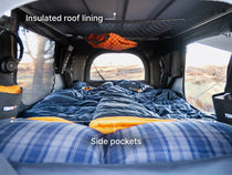  image showcasing the insulated roof lining and side pockets of the TentBox Classic rooftop tent.