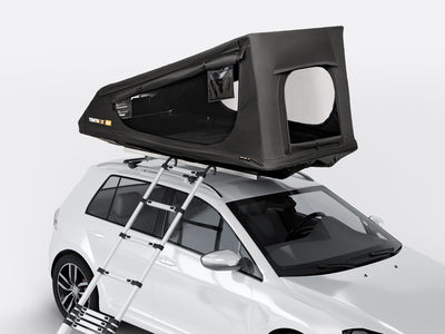 TentBox GO roof top tent attached to a white car with a ladder on a light grey background - Dachzelte
