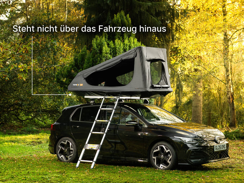  TentBox GO roof top tent on a car in a forest setting with text 'Stays within the footprint of your car'.