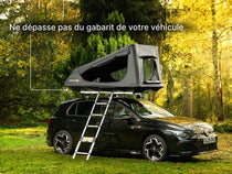  TentBox GO roof top tent on a car in a forest setting with text 'Stays within the footprint of your car'.
