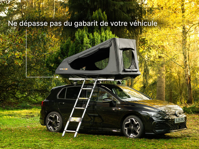  TentBox GO roof top tent on a car in a forest setting with text 'Stays within the footprint of your car'.