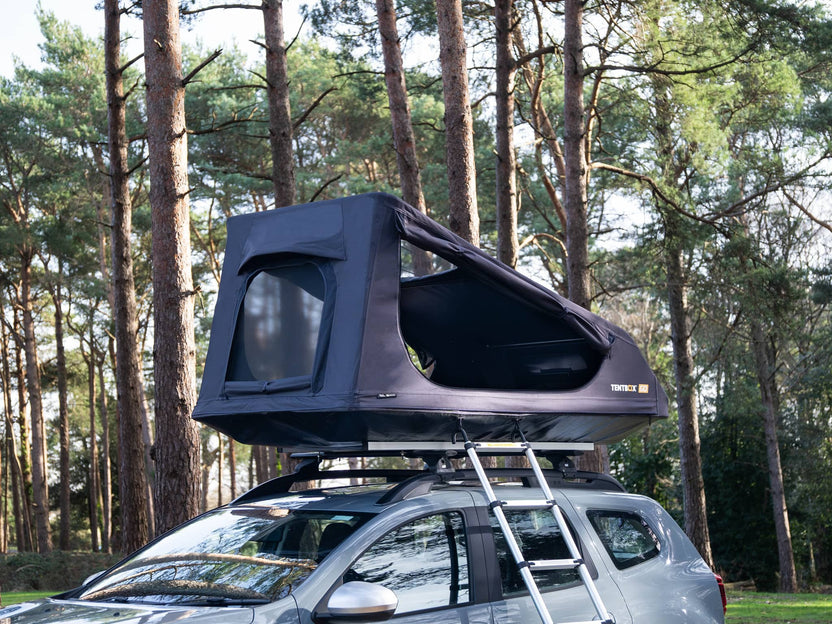 The TentBox GO installed on a Dacia Duster in the forest