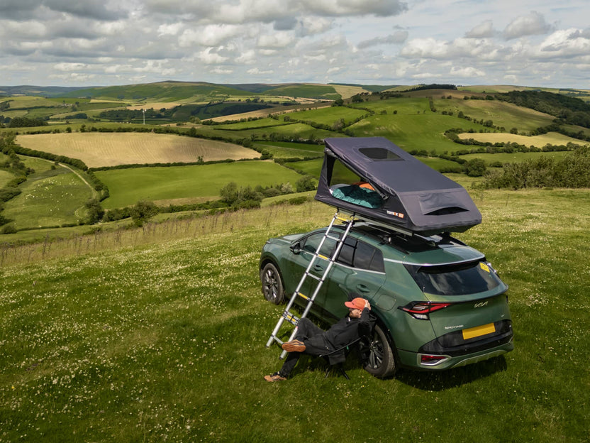 Man enjoying mountain views with his TentBox GO