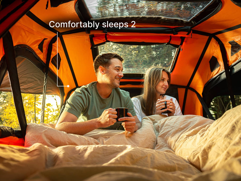  TentBox Lite roof tent with two people in to show it comfortably sleeps 2
