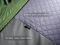  A detailed shot of the TentBox Lite roof tent quilted dual-core mattress and the durable, easy-clean fabric. 