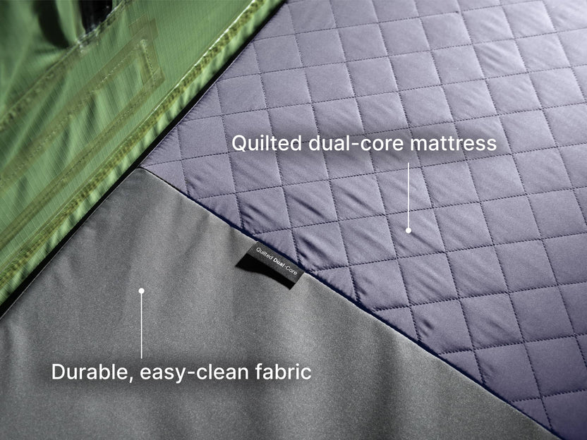  A detailed shot of the TentBox Lite roof tent quilted dual-core mattress and the durable, easy-clean fabric. 