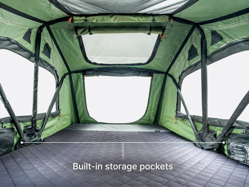  An image showing the internal large size and built-in storage pockets of the TentBox Lite roof tent 