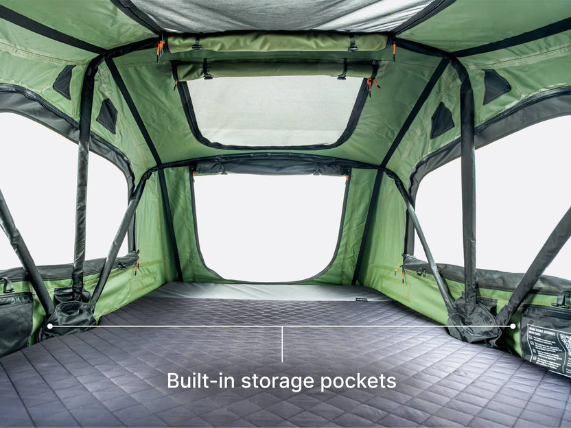 An image showing the internal large size and built-in storage pockets of the TentBox Lite roof tent 