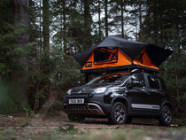 TentBox Lite 2.0 roof tent at a campsite, mounted on a small car