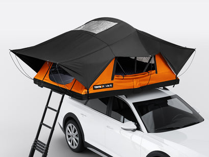 The TentBox Lite XL roof tent in Sunset colour option on top of a vehicle