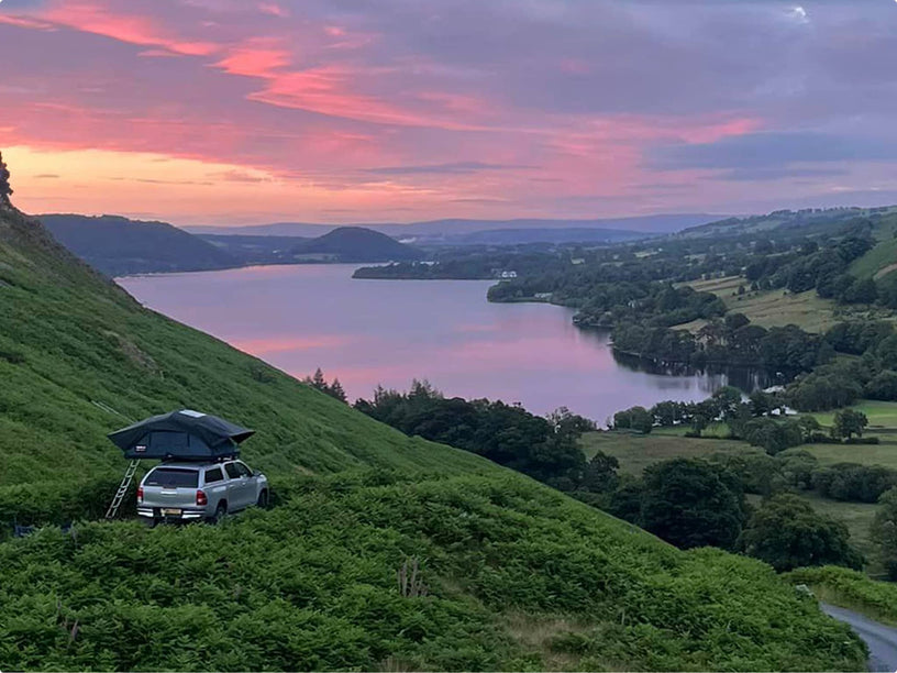 Picture of the TentBox Lite XL parked by lakeside at sunset