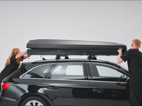 [autoplay][auto-fr][auto-de] video showing TentBox Classic roof tent being opened on the roof of a car